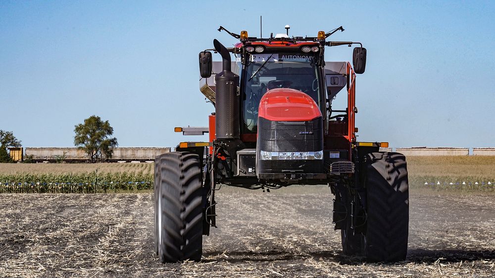 Approaching on a preprogrammed course, the driver-less Case IH Trident 5550 applicator with Raven Autonomy technology is the…