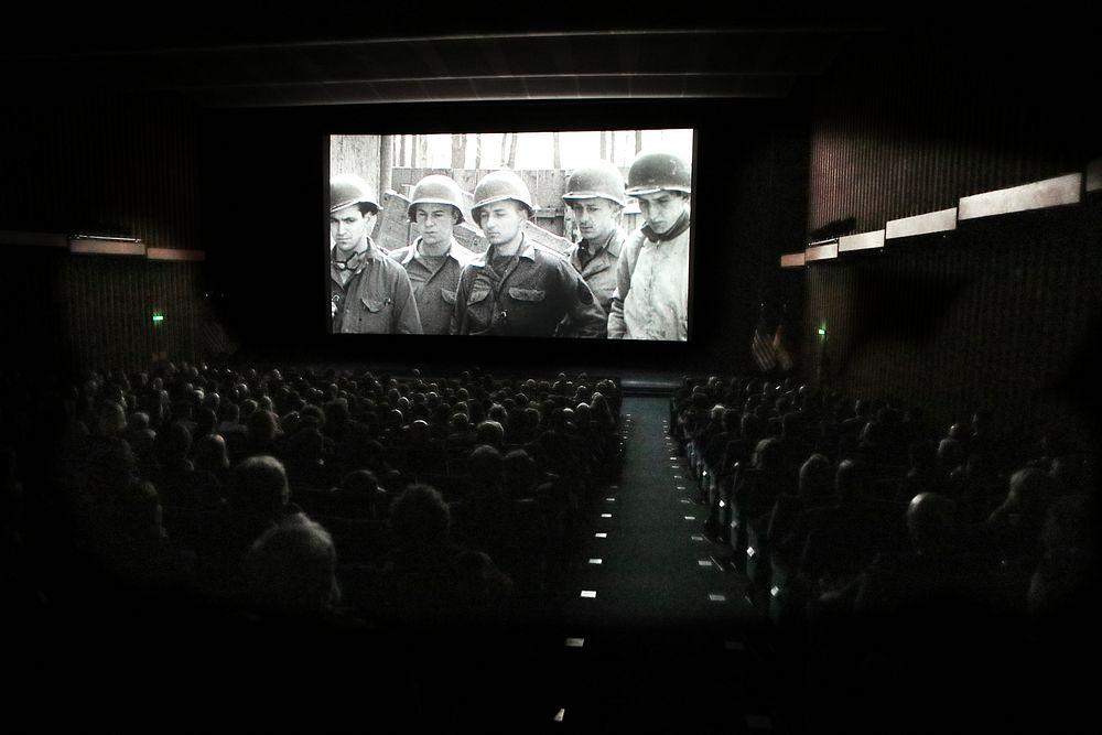 Historical movie in cinema. Original public domain image from Flickr