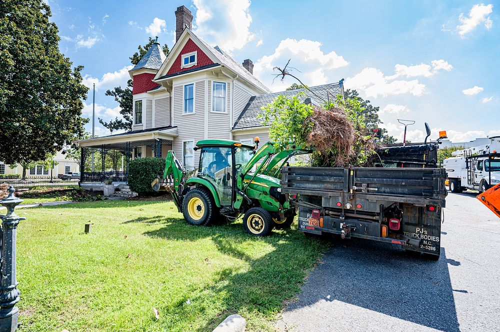 Fleming House LandscapingA Public Works crew removes overgrown trees and shrubs from around the Fleming House in preparation…