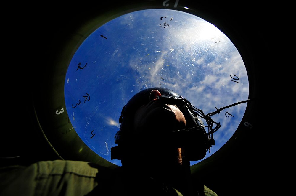 U.S. Air Force Staff Sgt. Stewart Guethlein looks for simulated enemy forces during exercise Cope North, Feb. 23, 2011.