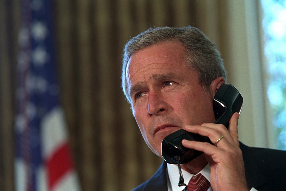 Pledging his support, President George W. Bush talks via telephone to New York Governor George Pataki and New York City…