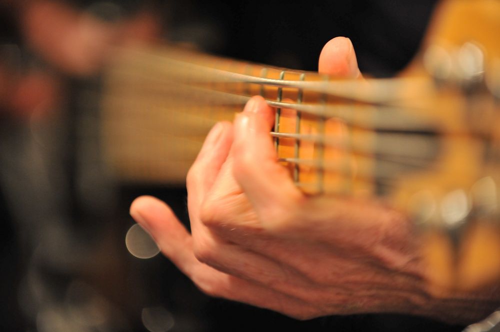 Playing guitar, guitarist, musician. Original public domain image from Flickr