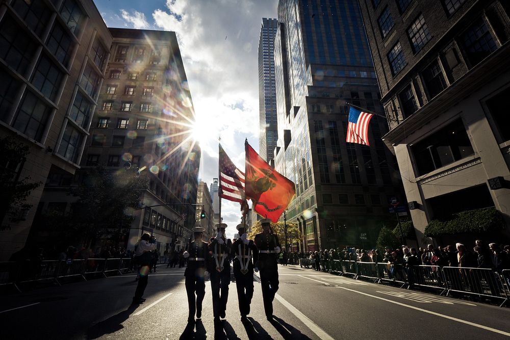 U.S. Service members with the 6th Communications Battalion, Marine Forces Reserve color guard, lead a marching detail of 200…