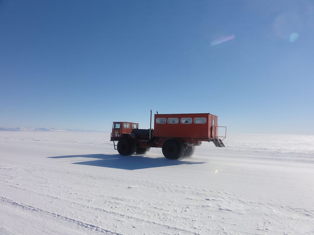 Red truck, snowy road, Antarctica. Original public domain image from Flickr