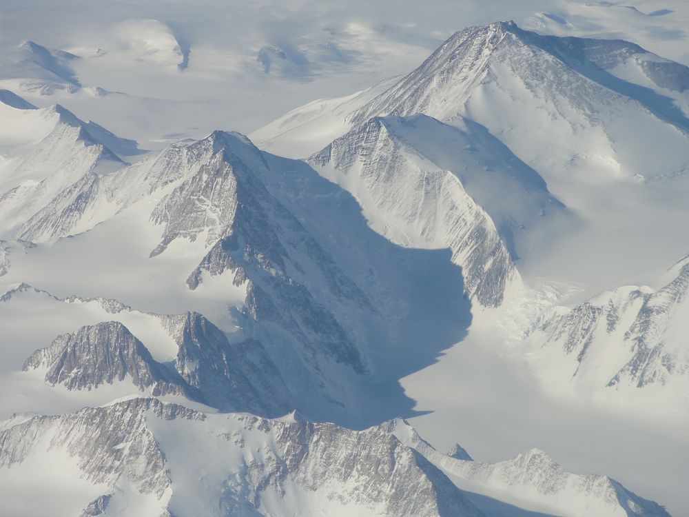 Snow mountain, aerial view, nature landscape. Original public domain image from Flickr