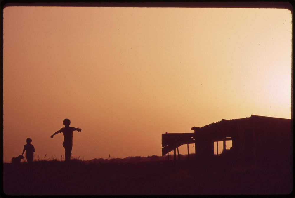 Farm youngsters playing at sunset near their home in Ripley, May 1972. Photographer: O'Rear, Charles. Original public domain…