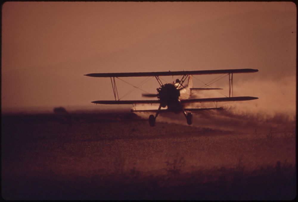 Crop duster plane at work in Imperial Valley. Original public domain image from Flickr