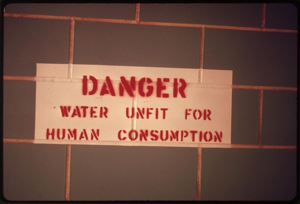 Sign in a restroom along Interstate 25 south of Colorado Springs, Colorado, warns that water is undrinkable, 04/1974.…
