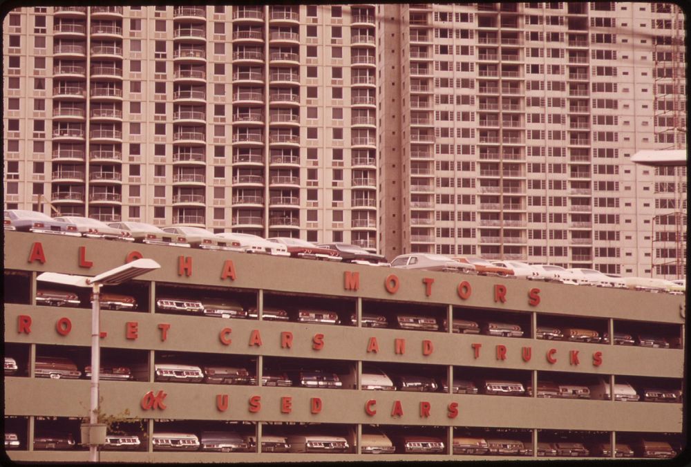 Every foot of space must count on the island: 4-decker car dealer's showroom and high-rise apartments, October 1973.…
