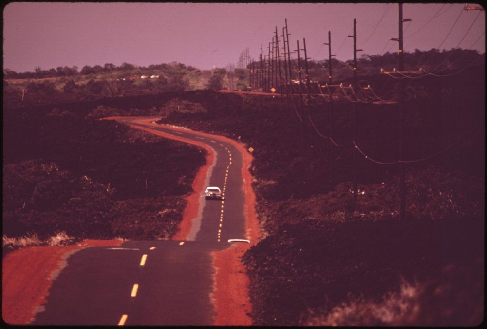 Highway 11 passing over 1868 lava flow near Waiohinu, November 1973. Photographer: O'Rear, Charles. Original public domain…