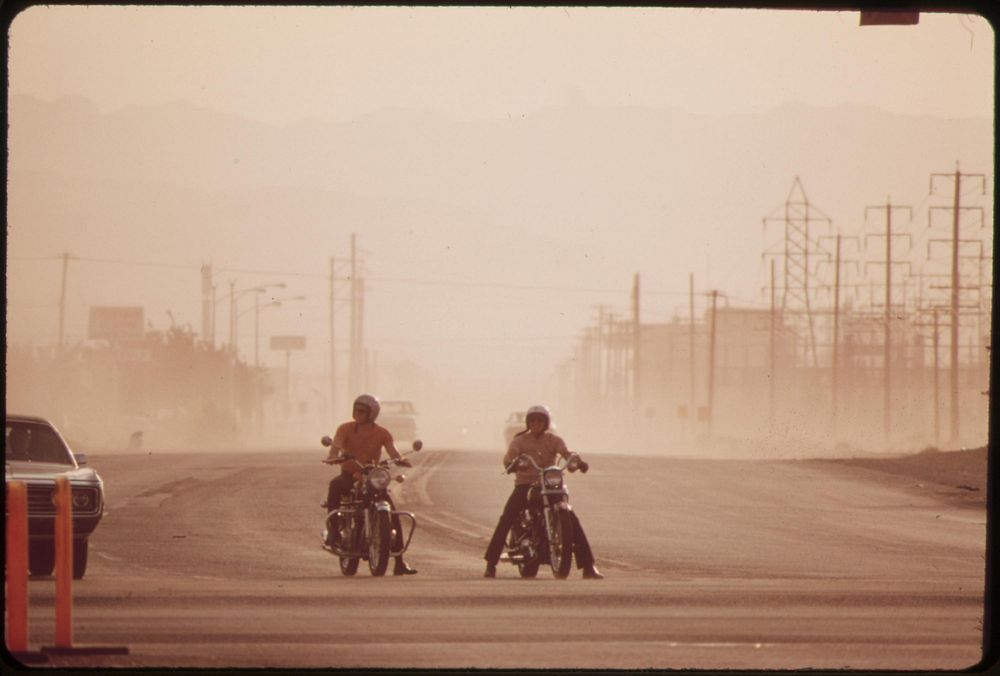 Dry heat and high winds equal eye-stinging, nose itching dust storm, May 1972. Photographer: O'Rear, Charles. Original…