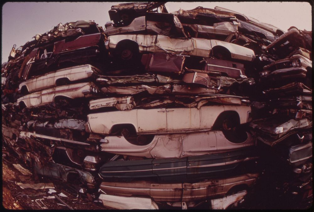 Stacked Cars In City Junkyard Will Be Used For Scrap, August 1973. Photographer: Swanson, Dick. Original public domain image…