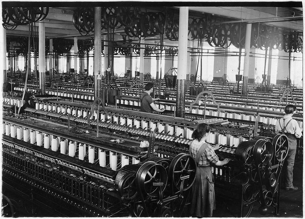 Three spinners in spinning room, 1912. Photographer: Hine, Lewis. Original public domain image from Flickr