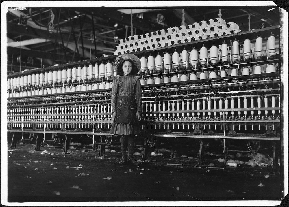 Young spinner in Roanoke Cotton Mills. Said 14 years old, but it is doubtful, May 1911. Photographer: Hine, Lewis. Original…