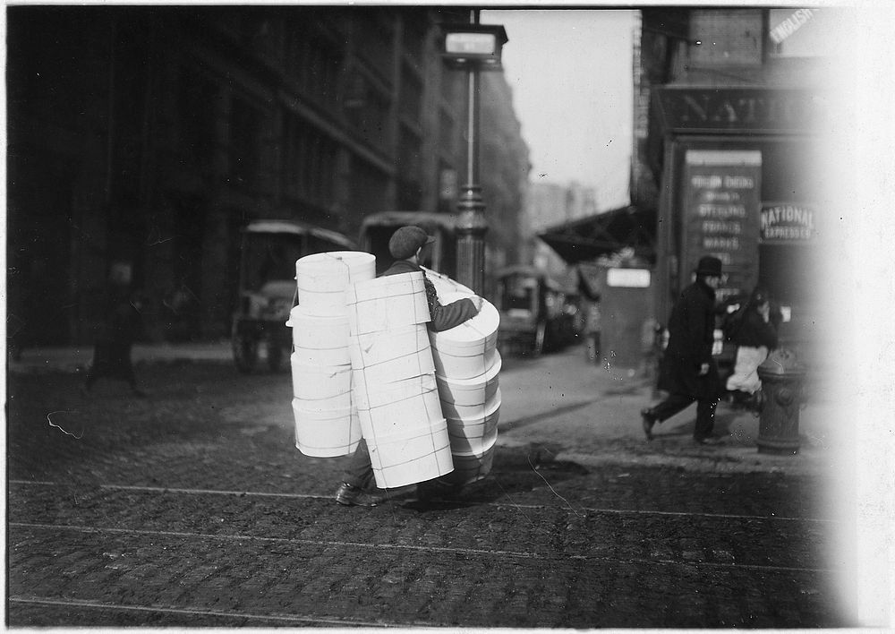 Boy carrying hats. New York City, February 1912. Original public domain image from Flickr