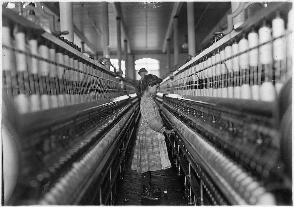 Spinner in Lancaster Cotton Mills. Lancaster, S.C, December 1908. Photographer: Hine, Lewis. Original public domain image…