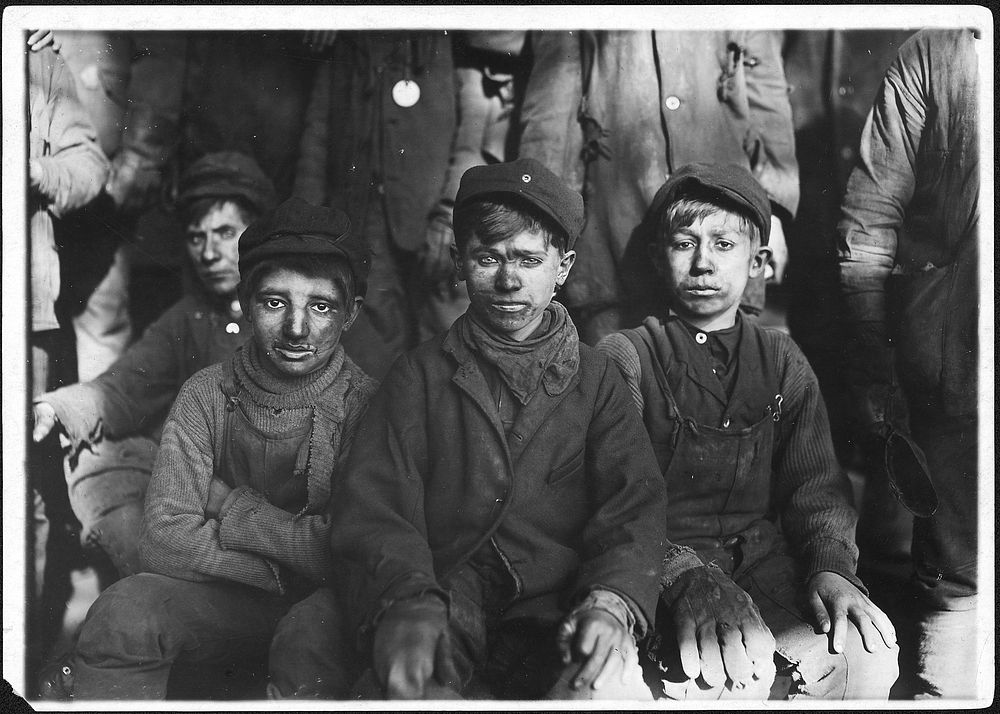 Group of breaker boys. Smallest is Sam Belloma. Pittston, Pa, January 1911. Photographer: Hine, Lewis. Original public…