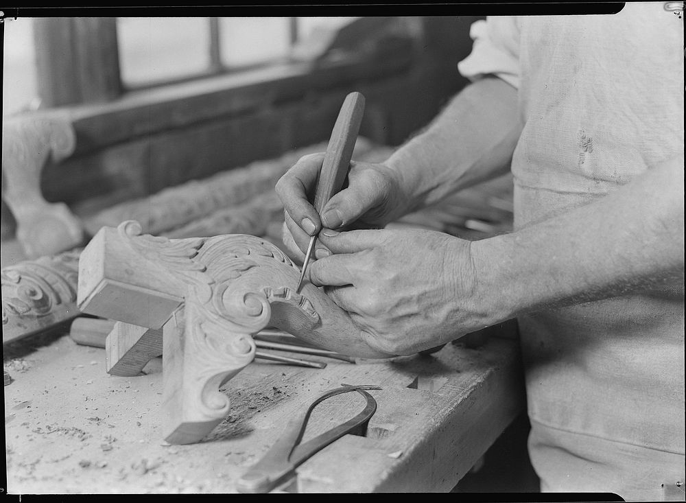 Hand carver - chair leg. Man has been in this business about 40 years; started at 19 years of age, 1936. Photographer: Hine…