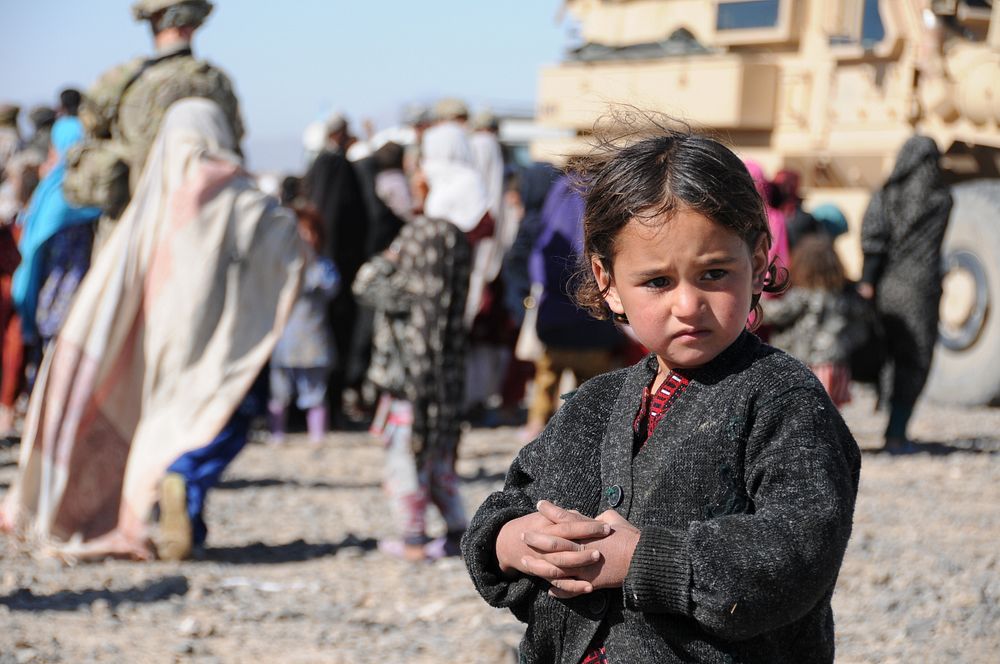 A young Farahi girl waits patiently to receive assistance during a visit to her village, Feb. 9. Provincial Reconstruction…
