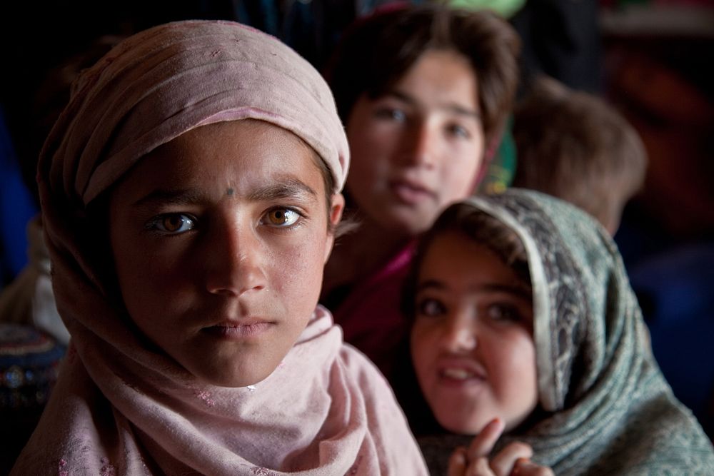 Afghan children gather before the start of a medical seminar for women Feb. 20, 2013, in Qarah Bagh district, Ghazni…