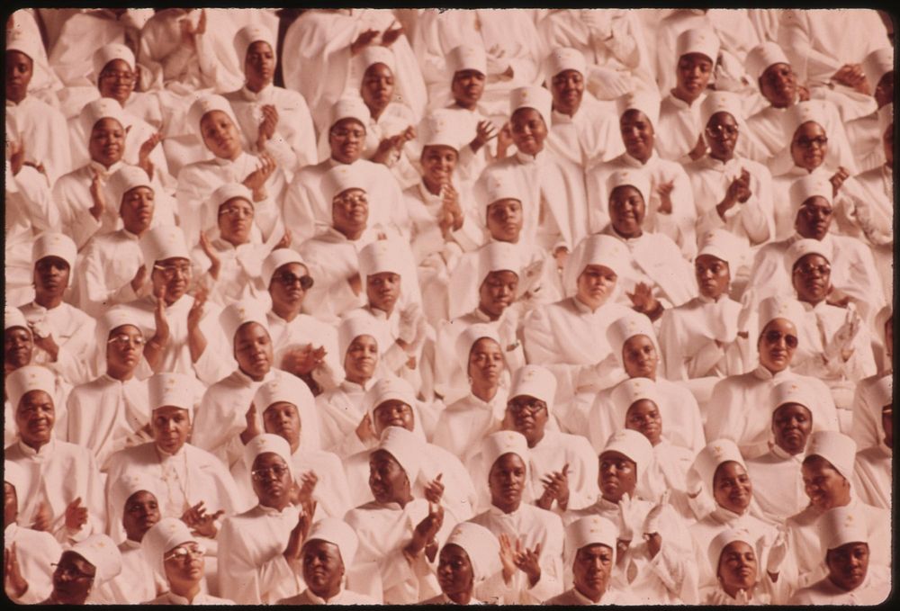 15-0673MBlack Muslim Women Dressed In White Applaud Elijah Muhammad During The Delivery Of His Annual Savior's Day Message…