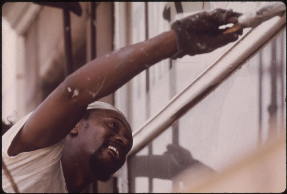 A Black Man Painting A Store Front On South Wabash Street, 07/1973. Photographer: White, John H. Original public domain…