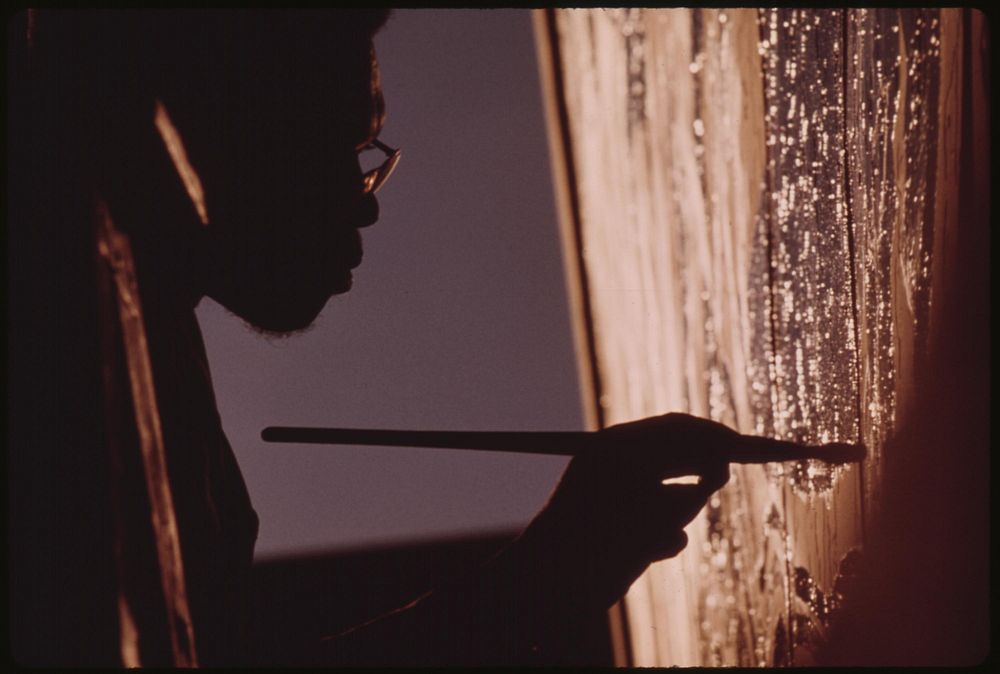 Artist Ron Blackburn Painting An Outdoor Wall Mural At The Corner Of 33rd And Giles Streets In Chicago, 10/1973.…