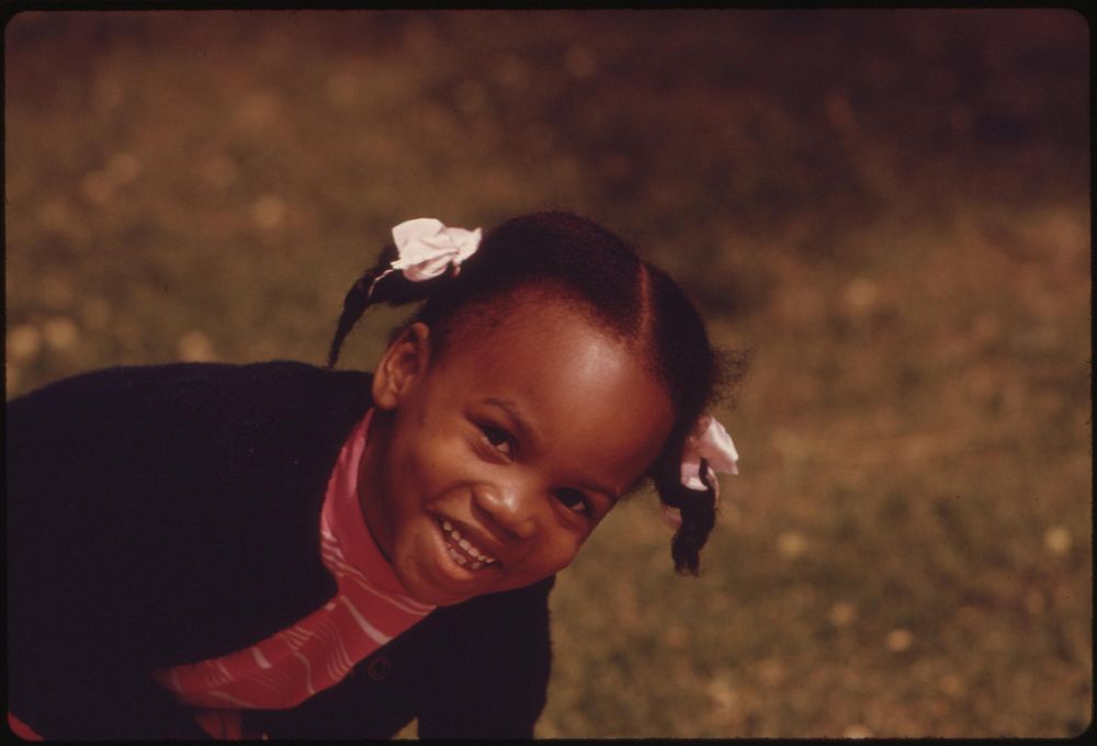 A Young Black Child, One Of The Nearly 1.2 Million People Of Her Race Who Make Up Over One Third Of Chicago's Population…