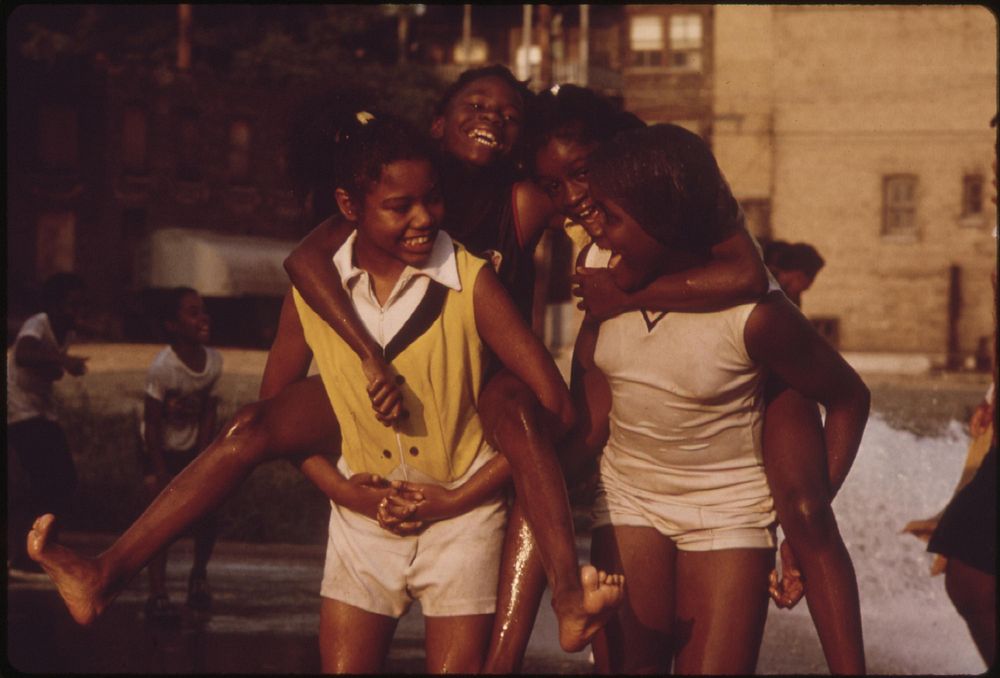Black Youngsters Cool Off With Fire Hydrant Water On Chicago's South Side In The Woodlawn Community, 06/1973. Photographer:…