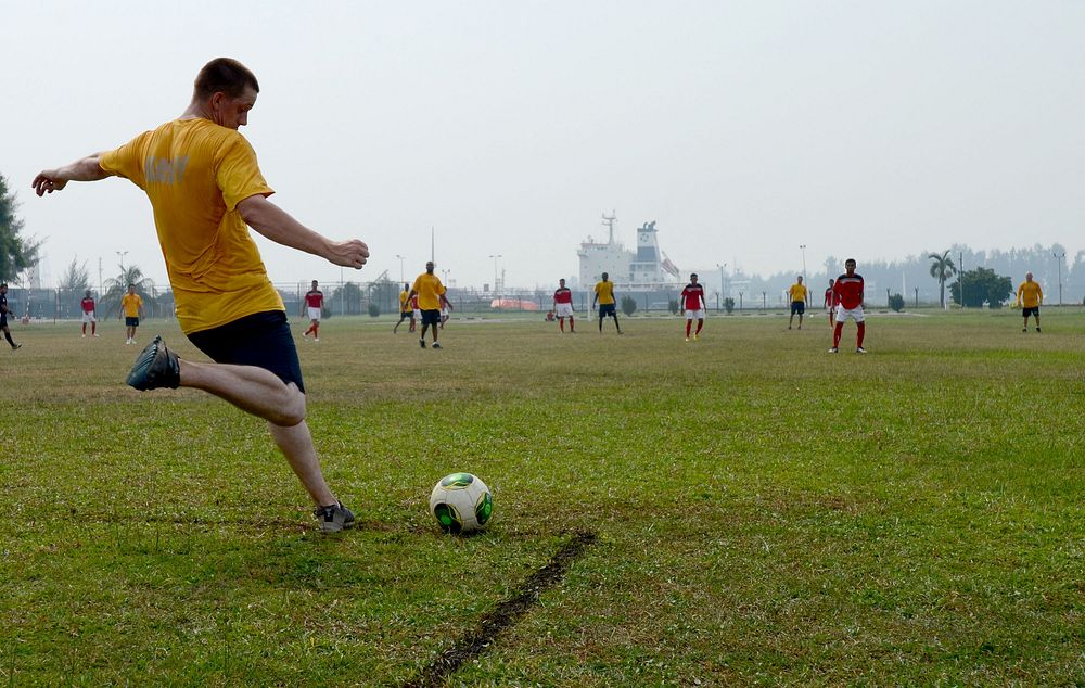 U.S. Sailors and members of the Malaysian Armed Forces play soccer during a sports day event in Kuantan, Malaysia, June 22…