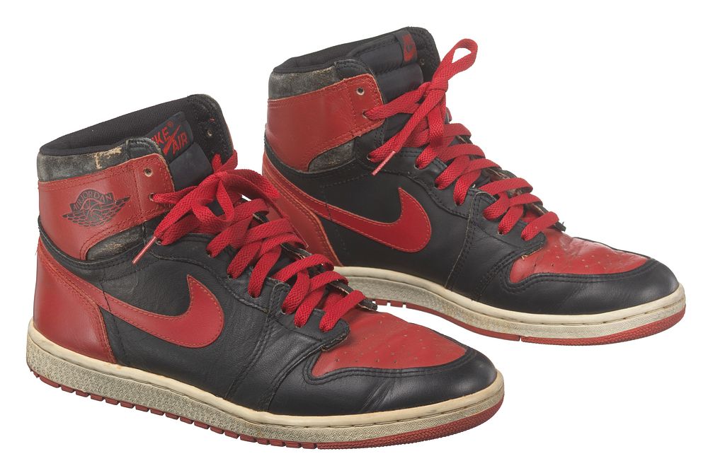 Pair of red and black Air Jordan I high top sneakers made by Nike, National Museum of African American History and Culture
