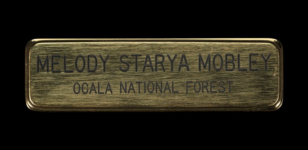 US Forest Service Ocala National Forest name badge worn by Melody Starya Mobley, National Museum of African American History…