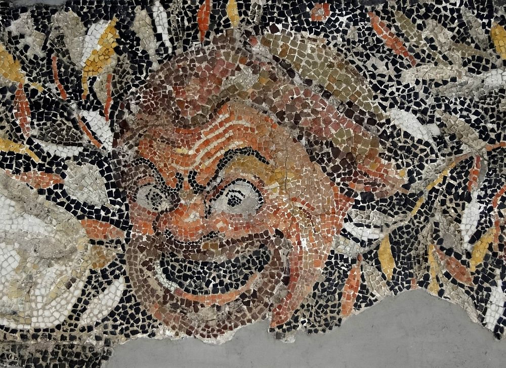 Mosaic of a mask on the border of the mosaic floor from the Insula of the Jewellery, Archaeological Museum of Delos, Greece