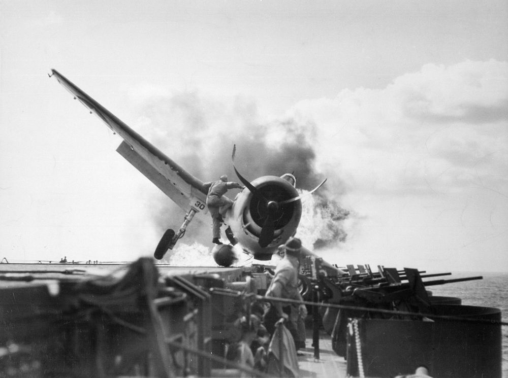Crash landing of a U.S. Navy Grumman F6F-3 Hellcat (Number 30) of Fighting Squadron 2 (VF-2) aboard the aircraft carrier USS…