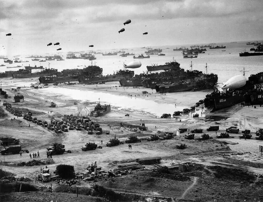Landing ships putting cargo ashore on Omaha Beach, at low tide during the first days of the operation, mid-1944-06Among…