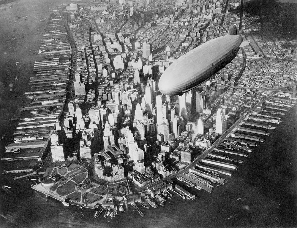 The U.S. Navy airship USS Akron (ZRS-4) flying over the southern end of Manhattan, New York, New York, United States, circa…