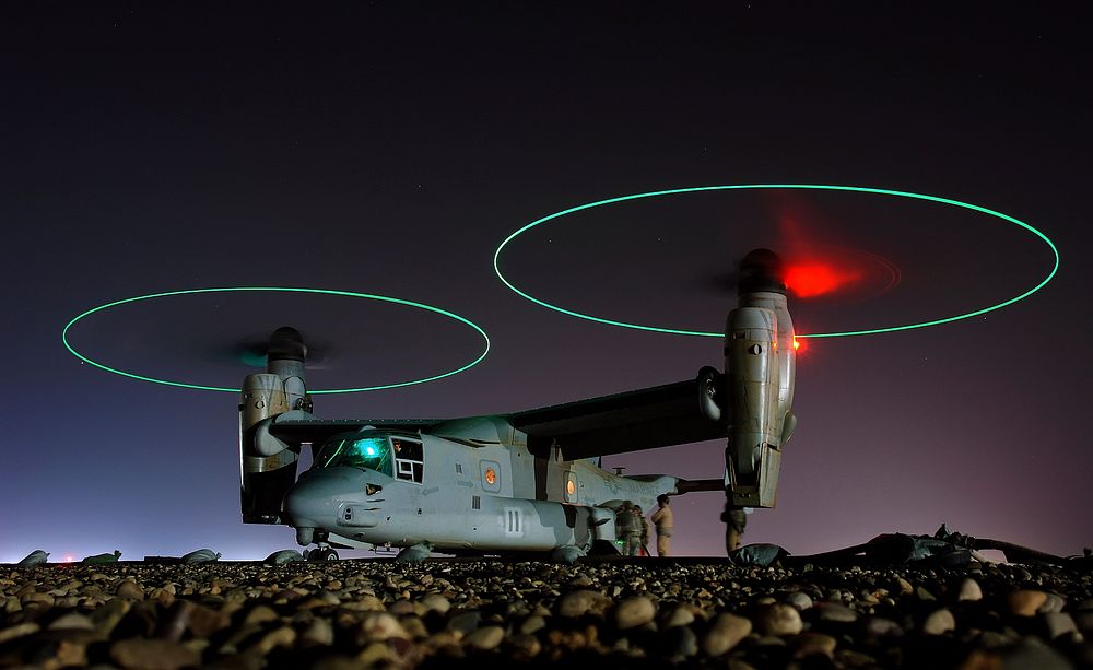 Crew members refuel an A V-22 Osprey before a night mission in central Iraq.