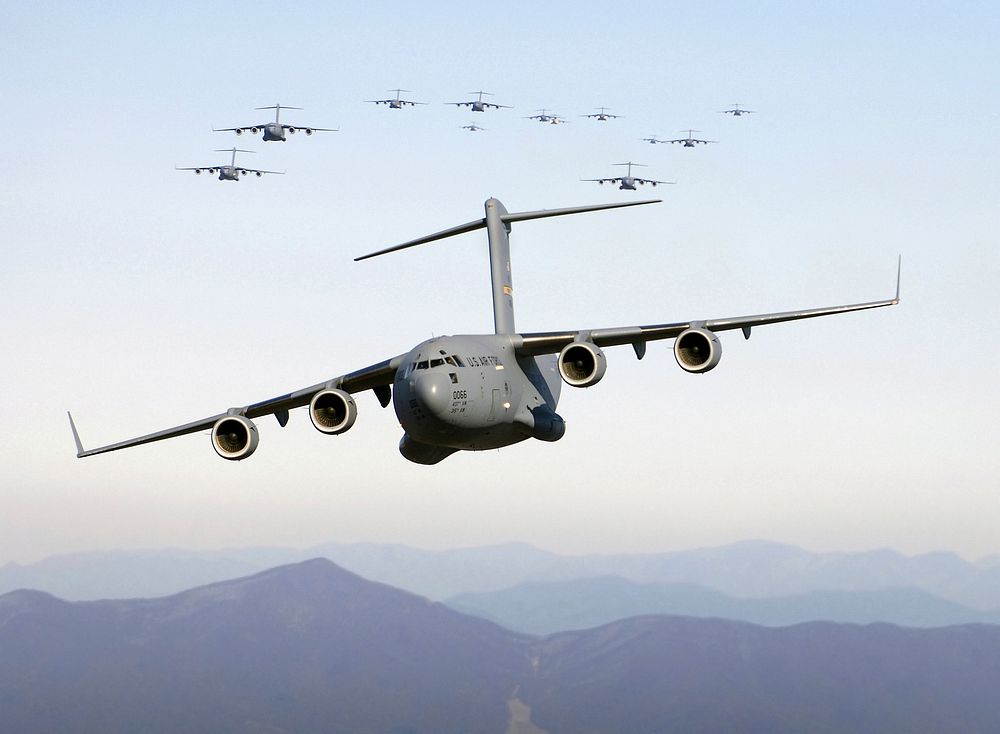 Thirteen C-17 Globemaster III aircraft fly over the Blue Ridge Mountains in Virginia during low level tactical training Dec.…
