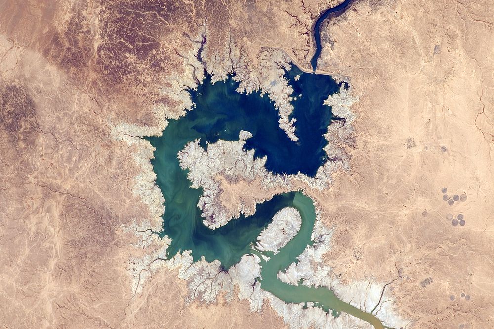 Lake Qadisiyah, as seen from the ISS"Colors patiently swirl in a reservoir in Iraq. The #StoryOfWater." - Kjell Lindgren