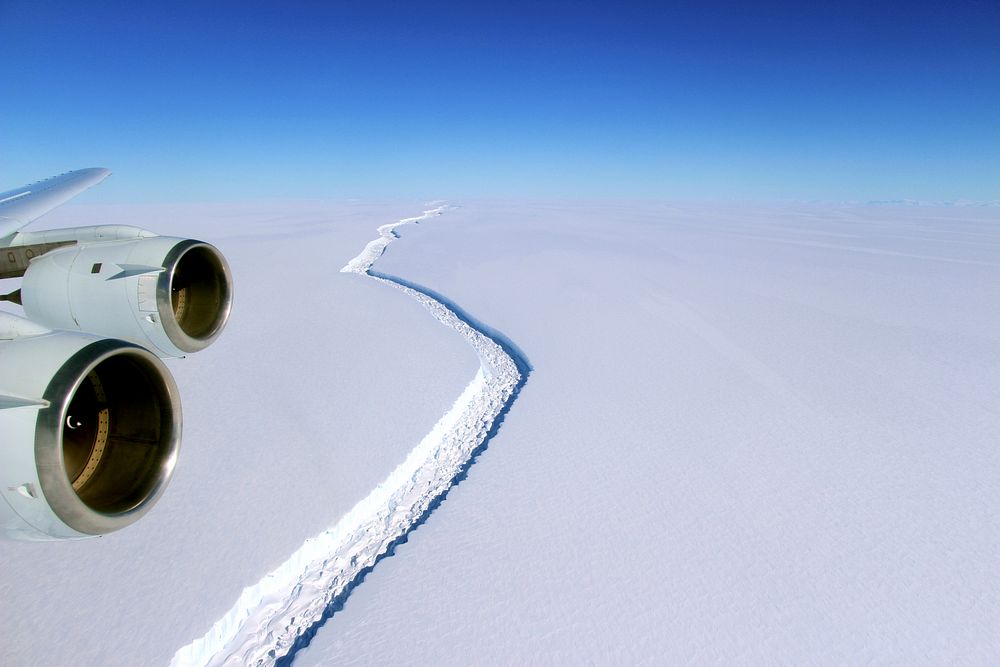 These photograph shows the wide view of the rift in Larsen C from the vantage point of NASA’s DC-8 research aircraft. NASA…