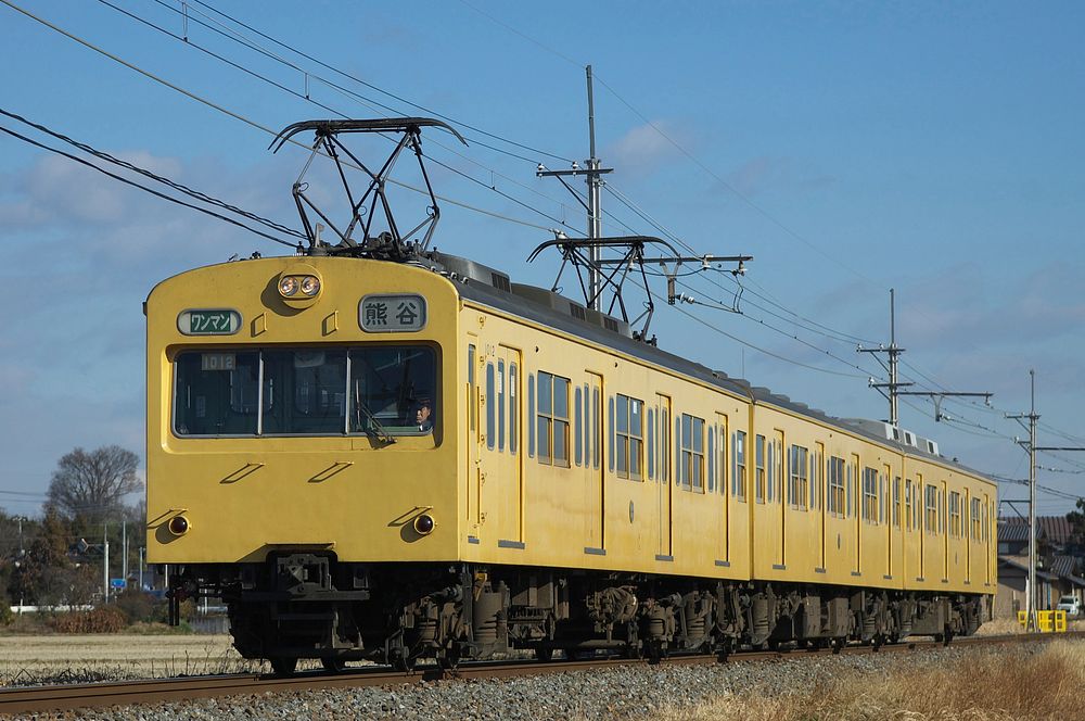 Chichibu Railway 1000 series EMU 3-car set 1012 in "canary yellow" livery on the Chichibu Main Line between Bushu-Araki and…