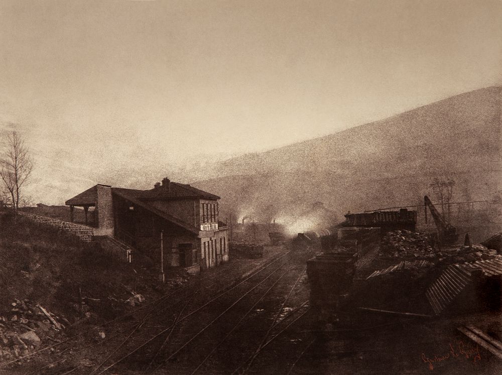 Train station with train and coal depot. Signed "Gustave Le Gray".