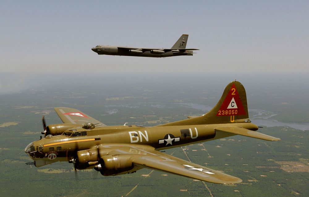 A B-17G Flying Fortress (nose art Thunderbird), below, and a B-52H Stratofortress flying in a heritage flight formation…