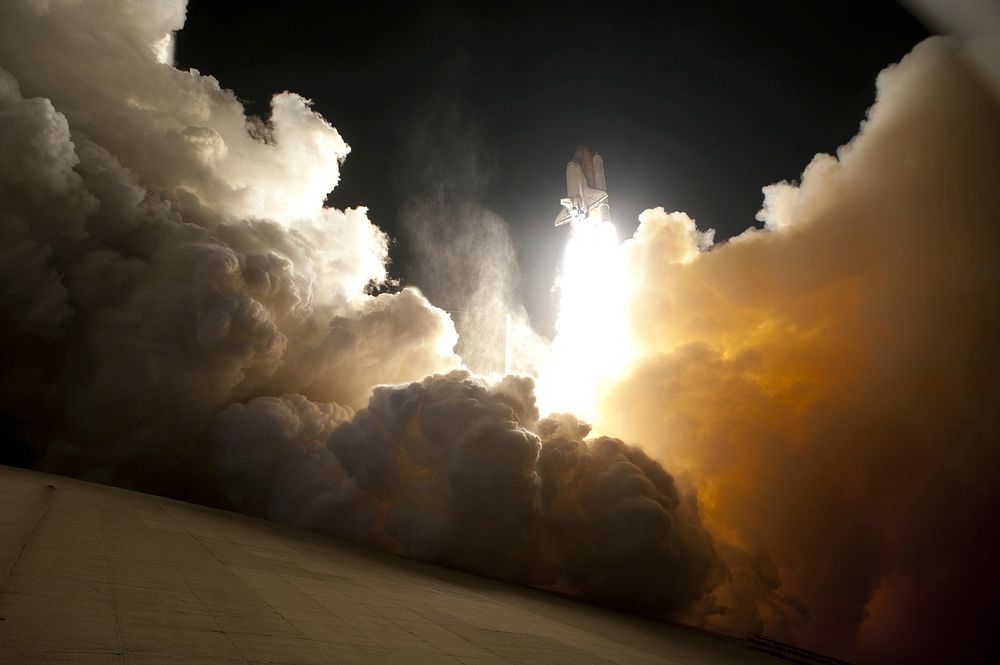 An exhaust cloud engulfs Launch Pad 39A at NASA's Kennedy Space Centre in Florida as space shuttle Endeavour lifts off into…