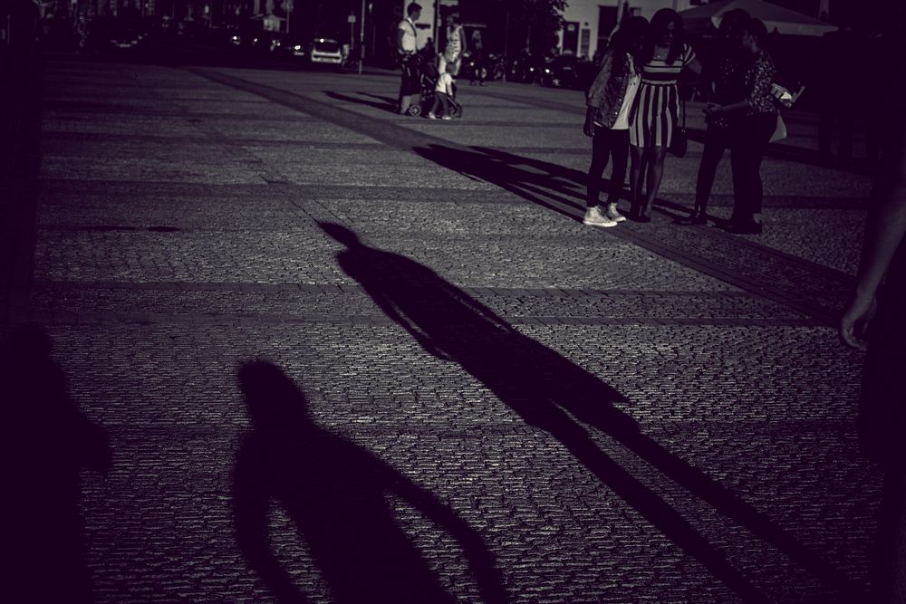 Pedestrian street shadows, black & white. View public domain image source here