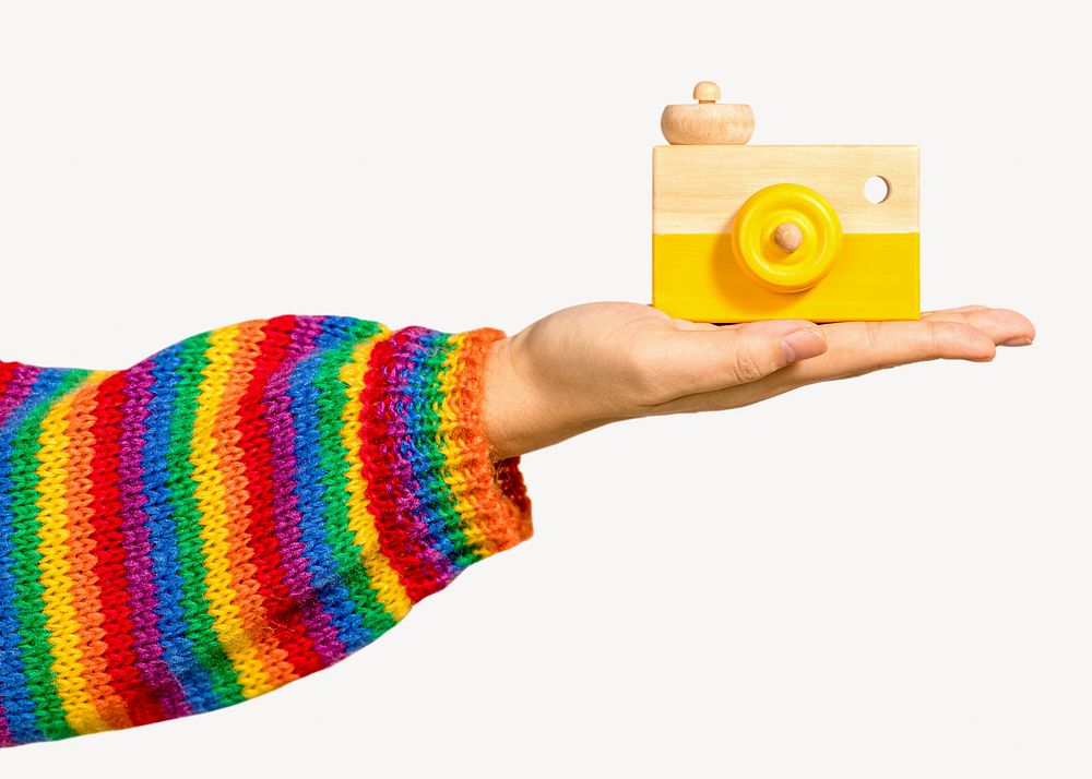 Cute woman holding toy camera
