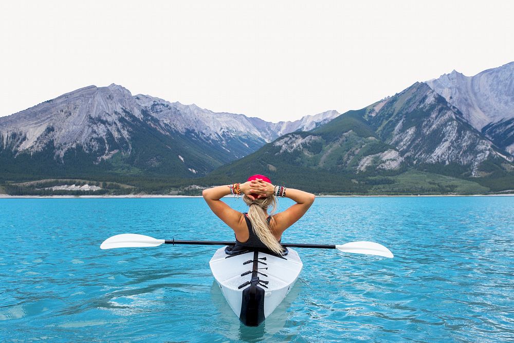 Woman tourist in kayak lake border, travel photo
