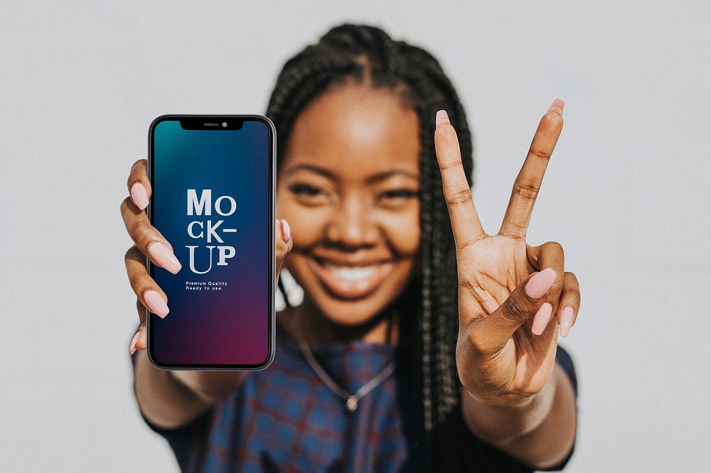 Black woman showing a v sign with a phone mockup