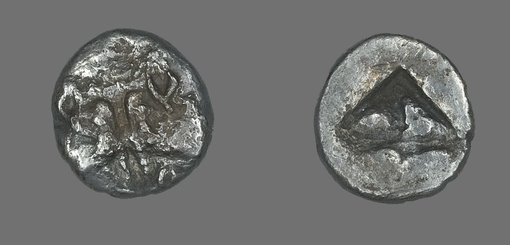 Coin Depicting Two Calves Heads by Ancient Greek
