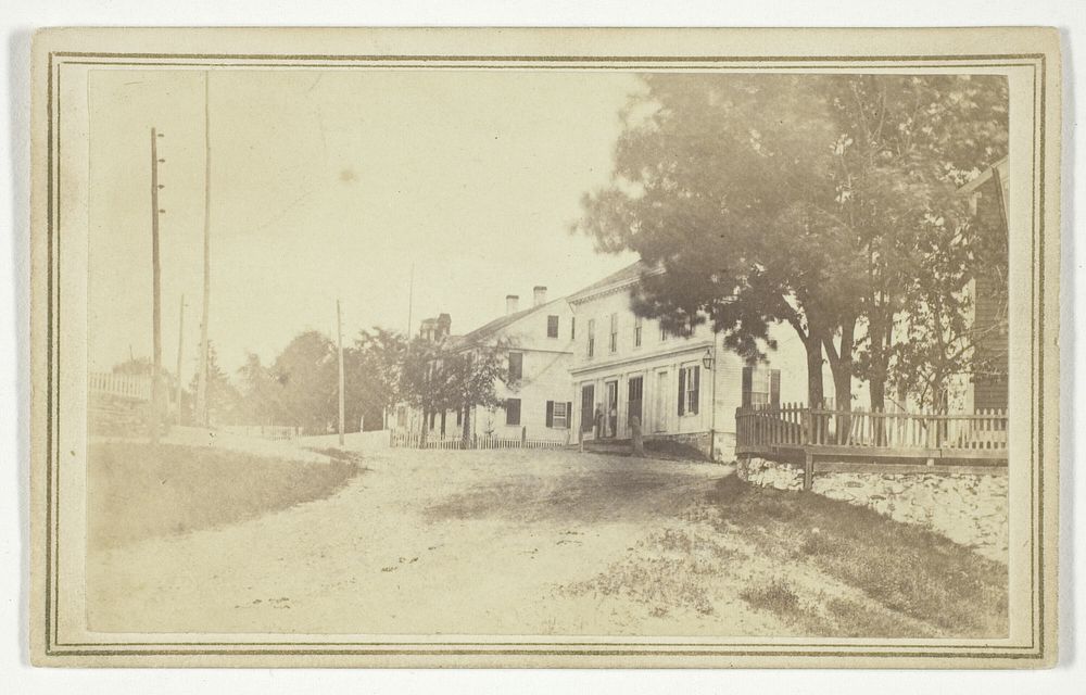 Untitled (view of road with white clapboard houses) by T. Holmes